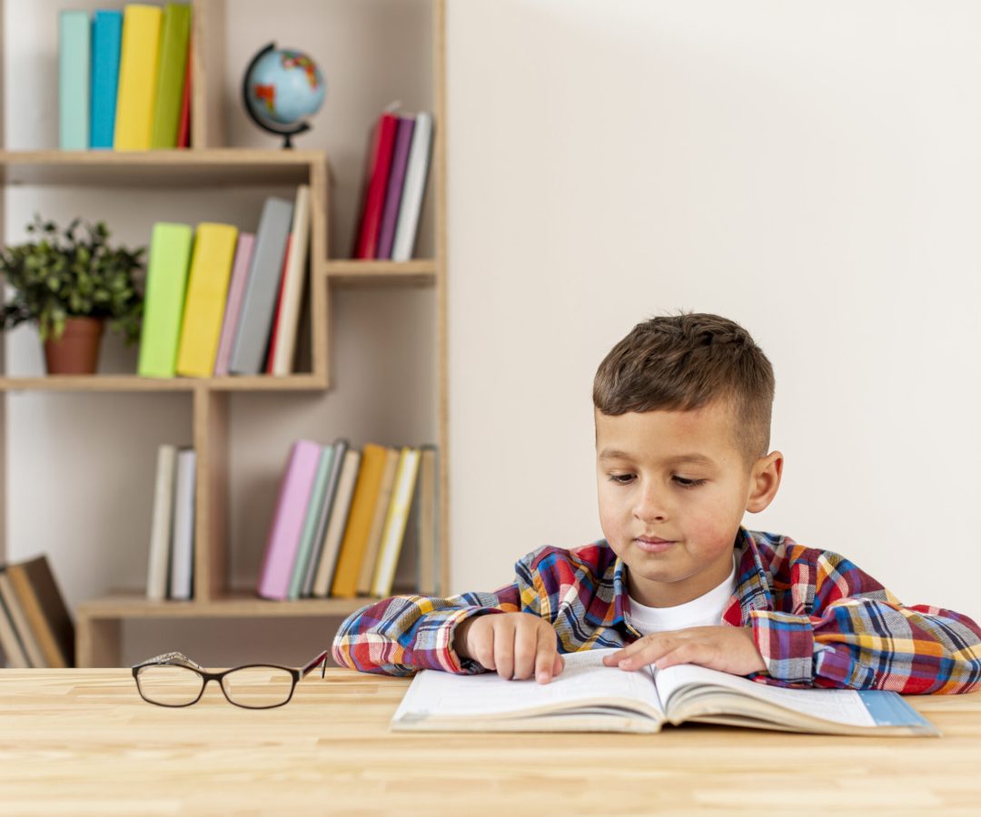front-view-little-boy-reading